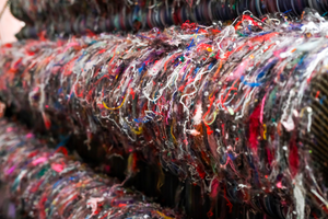 Close-up of colorful bracelets stacked together